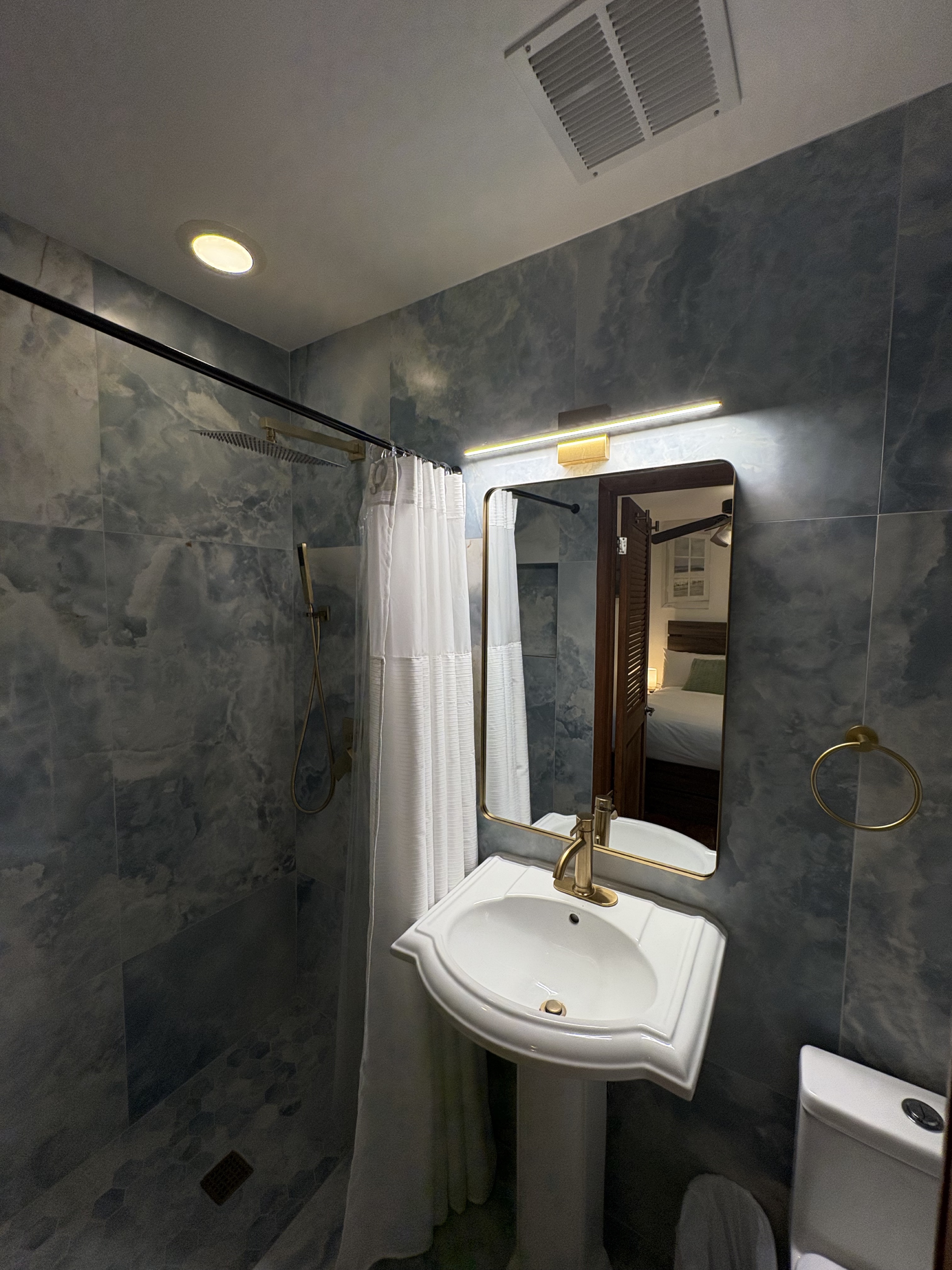 Full blue stone bathroom remodel