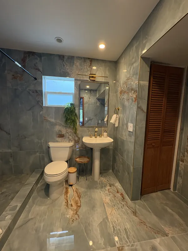 Full view of luxury blue bathroom remodel