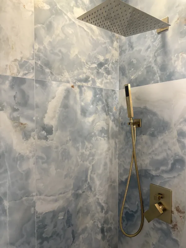 Closeup of rain shower and handheld shower
